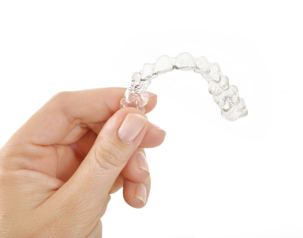 Holding a clear aligner
